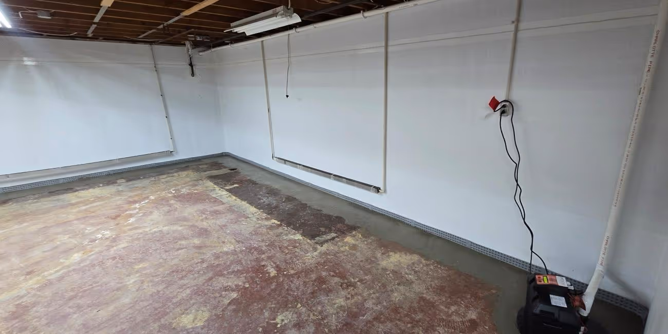 Basement after waterproofing with clean, dry floor